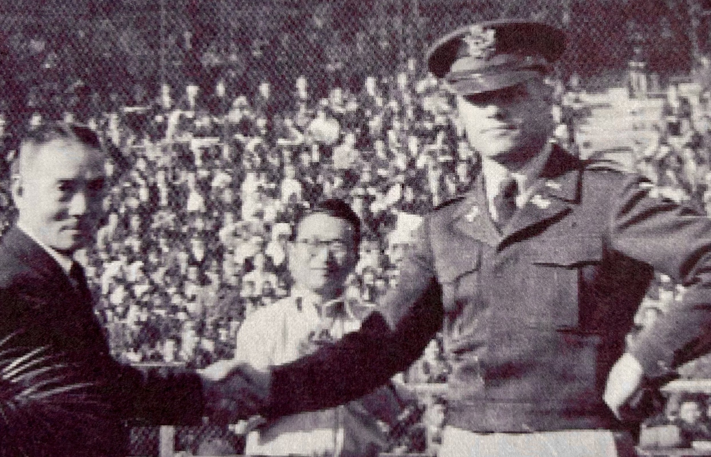 Uncle Bill (right), coach of the American team, shakes hands with the Japanese coach (left) before the game.